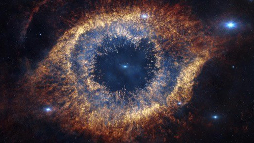 Bild från IMAX® 3D filmen Hidden Universe som visar Helixnebulosan i infrarött.